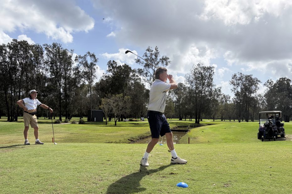 Dave Mattacott dancing on the 8th in his follow-through as Geoff McCann watches on. Dutifully.