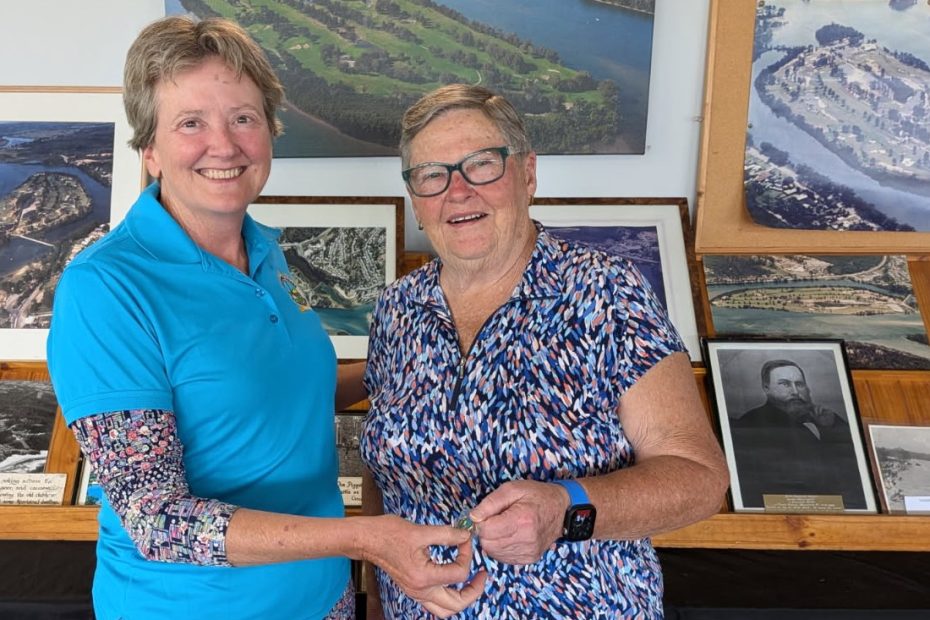 Linda Piccin (left) congratulates Elizabeth Hobday on her Div 1 Monthly Medal win at The Island Golf Course.